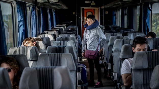 A passenger stretches her legs on the long trip from Serbia to Hungary. 