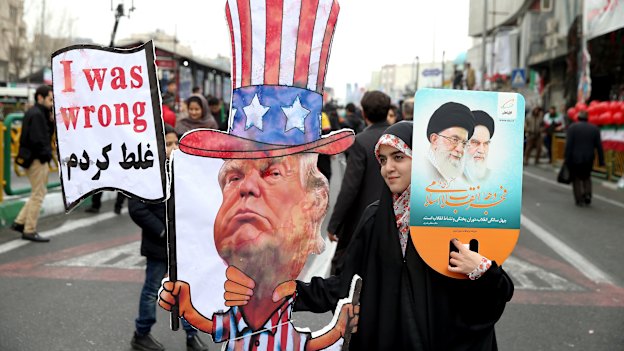 An Iranian woman holds an effigy of US President Donald Trump during a rally.