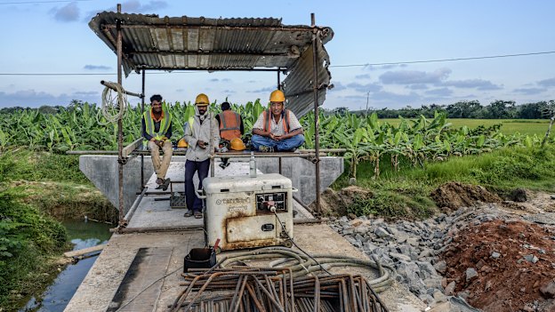Workers on an expressway developed by a Chinese company in Hambantota in 2018. Mahinda Rajapaksa spearheaded the project.