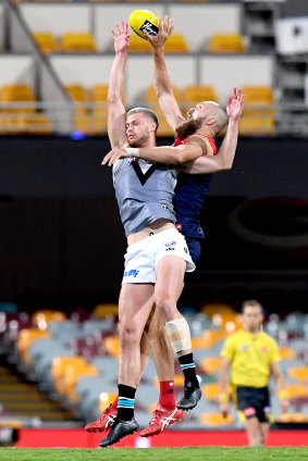 Melbourne's Max Gawn battles Peter Ladhams. 