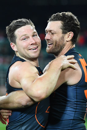 Giants Toby Greene and Sam Reid celebrate beating the Swans during last year’s finals series.