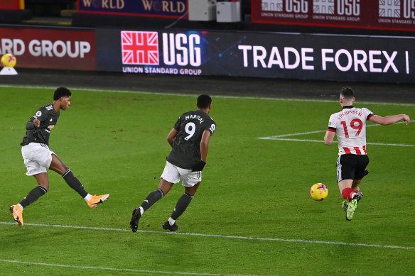 Marcus Rashford scores United’s third and his second at Bramall Lane.