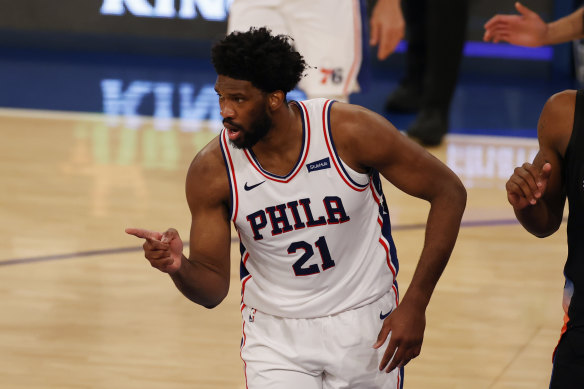 Joel Embiid celebrates a basket against the Knicks.