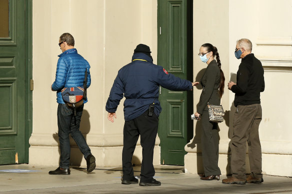 Members of the public in line to receive the COVID-19 vaccine at the Royal Exhibition Building.