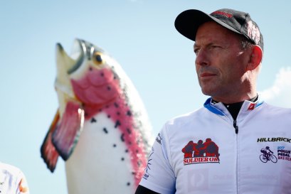 Former prime minister Tony Abbott with the Big Trout in Adaminaby during the Pollie Pedal bike ride in April 2017.