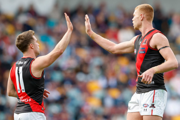 Peter Wright (right) helped get the Bombers over the line.