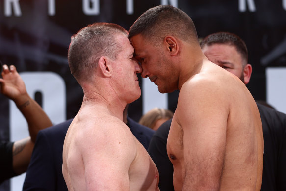 Paul Gallen and Justin Hodges get up close and very personal at Wednesday’s weigh in.