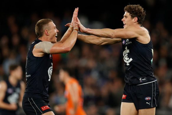 Patrick Cripps (left) and Charlie Curnow of the Blues celebrate during a match against the Giants last month.