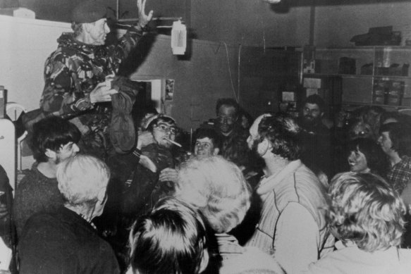 Major-General Jeremy Moore held aloft by Falkland Islanders in Port Stanley.