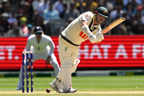 Travis Head battles the conditions on the second day of the Melbourne Test.