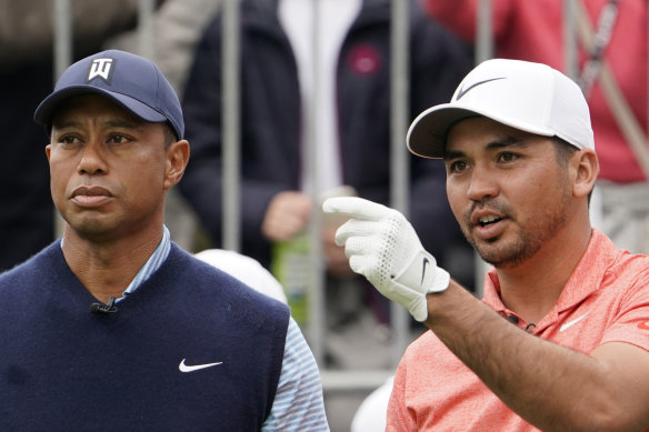 Tiger Woods (left) sympathises with Jason Day's infrequent appearances in Australia.