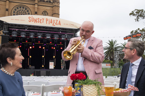 NSW Treasurer Dominic Perrottet and City of Sydney Lord Mayor Clover Moore with Australian jazz legend James Morrison at the launch of Sunset Piazza, Cathedral Square. 
