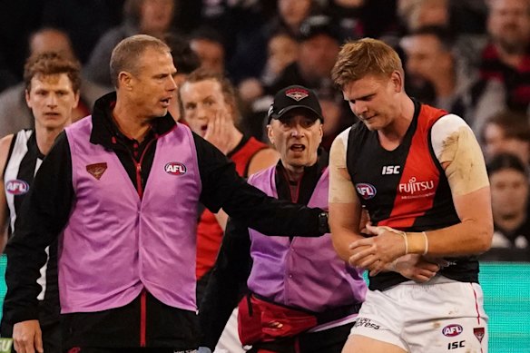 Bomber Michael Hurley leaves the field hurt in a game that had lots of injuries.