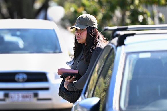 A woman leaving the property this week.
