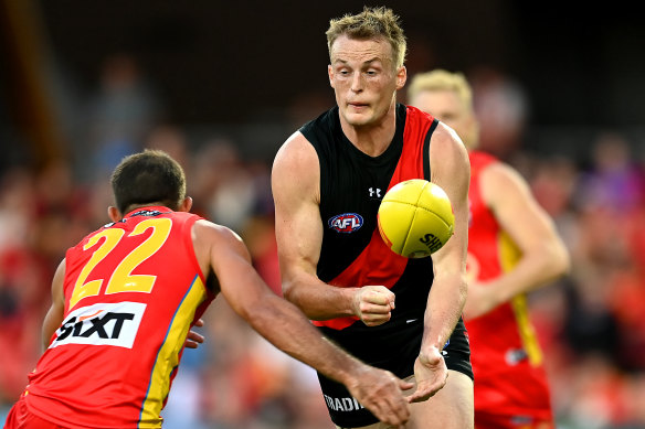 Mason Redman gets a handball away against Gold Coast.