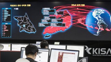 Employees watch electronic boards to monitor possible WannaCry ransomware cyber attacks at the Korea Internet and Security Agency in Seoul, South Korea.