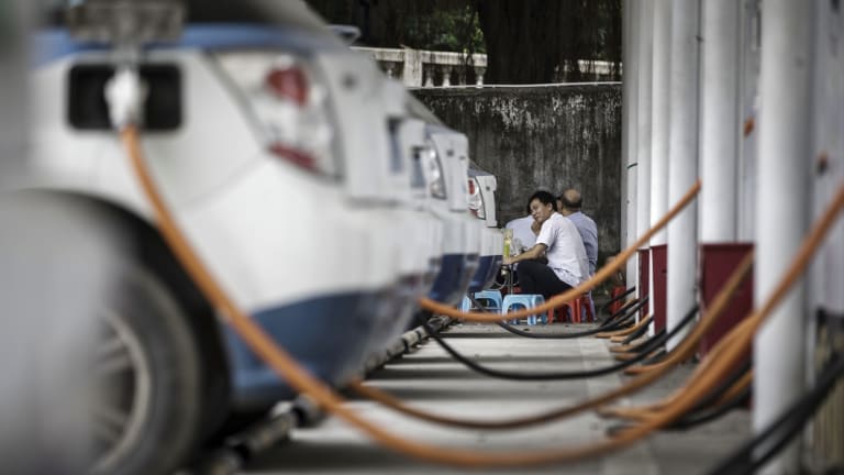 Electric taxis are pictured recharging in China. Chile will look to introduce more electric charging points to meet what the government hopes will be a growing demand for electric vehicles.
