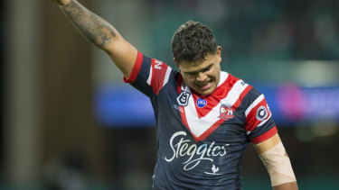 Loving life: Latrell Mitchell celebrates a record-breaking night against the Tigers.