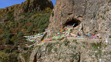 The Baishiya Karst Cave above the Jiangla riverbed in the Gansu province of China where the jawbone fragment was found.