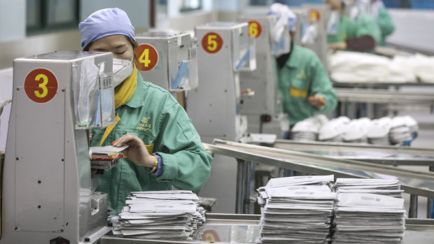 Face mask production at a factory in Shanghai. China is furiously manufacturing medical equipment to continue its dominance in the sector.