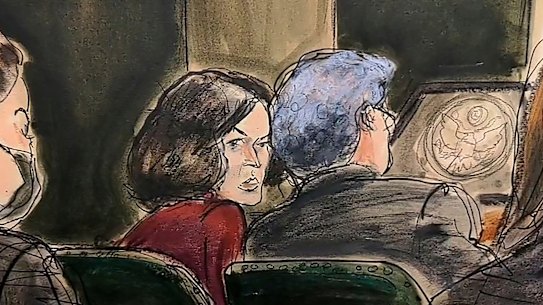 In this courtroom sketch, Ghislaine Maxwell center, confers with her defense attorney Jeffrey Pagliuca.