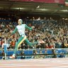 Cathy Freeman crosses the line to win gold at the Sydney 2000 Olympics.