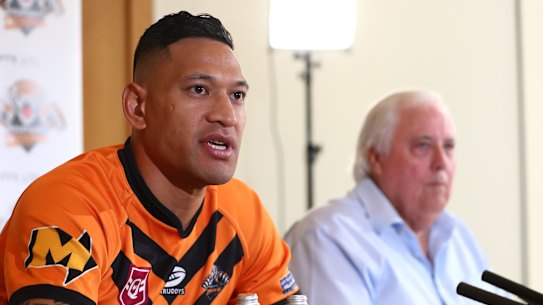 Israel Folau, pictured with backer Clive Palmer, said on Friday he was excited to return to the “grassroots level”.