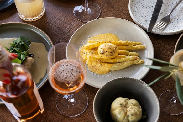 Carbonara poached egg with white asparagus.