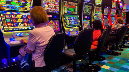 Patrons gamble on the poker machines at Bankstown Sports Club in Sydney