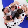 Curling gold medallists Brad Jacobs, Marc Kennedy, Brett Gallant and Ben Hebert, of Team Canada, celebrate victory with coach Paul Webster.