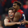 Demons hang on as Crows swoop late, Giants thump Suns