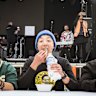 Taste test: Adhish Rai, centre, in blue beanie, competes in the momo speed eating competition at Momo Fest.
