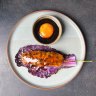 BBQ chicken and king prawn tsukune with cumquat glaze and soy cured egg at Babyface Kitchen.