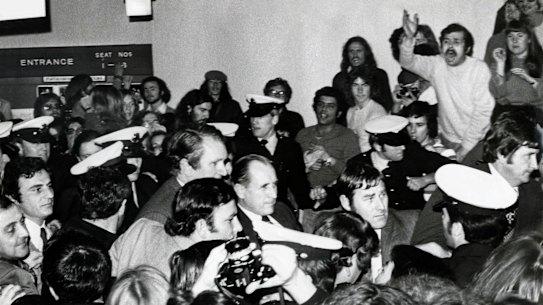 Malcolm Fraser and his bodyguards are surrounded by protestors at Monash University, August 1976