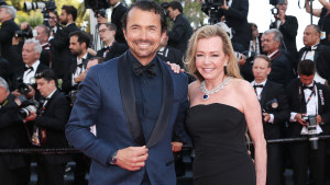 French actor William Abadie and Caroline Scheufele at the opening ceremony of the 75th Cannes Film Festival on May 17. Scheufele is wearing a sapphire and diamond necklace from the Red Carpet 2022 Collection.