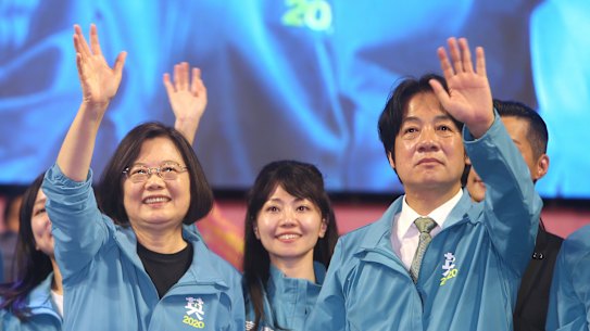 Taiwanese President Tsai Ing-wen, left, waves to supporters while launching her re-election campaign in Taipei in November.