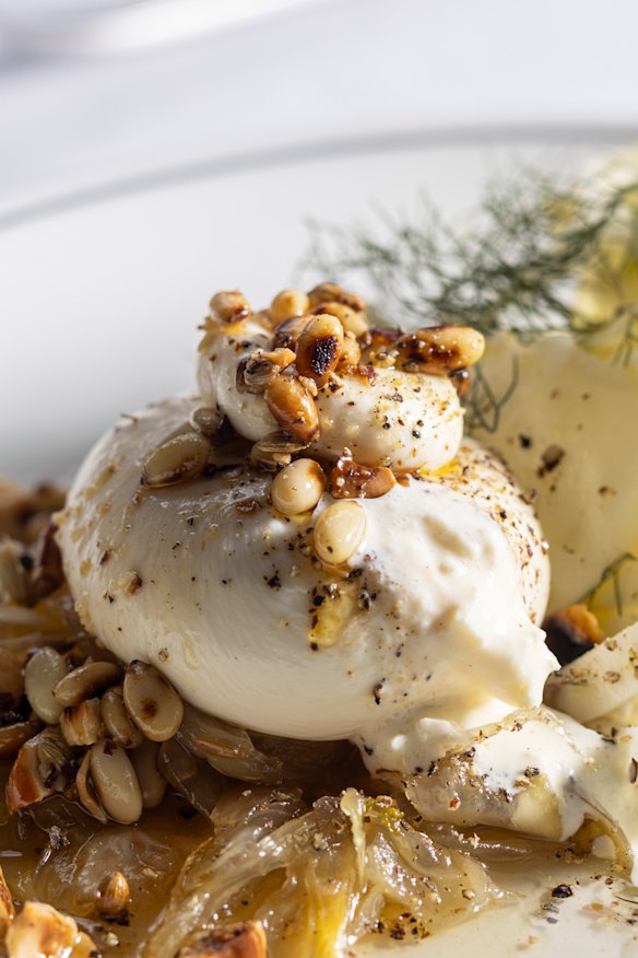 Burrata served over sweet-tart fennel marmellata with pine nuts and coriander seeds.