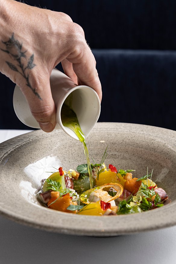 Smoked eel parfait served with summer tomatoes and dressed with tomato consomme that’s poured tableside.