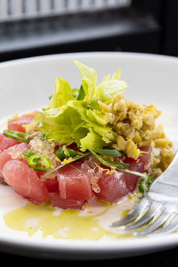 Pesce crudo with toasted almond milk and a green olive emulsion.