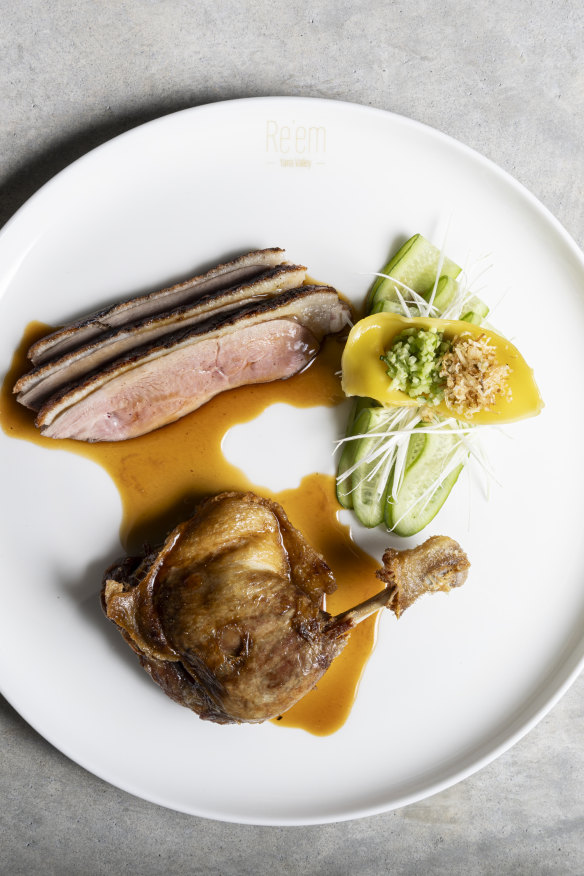 Duck with confit leg, wonton and shaved cucumber.