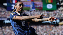 Bradley Barcola of France celebrates scoring.