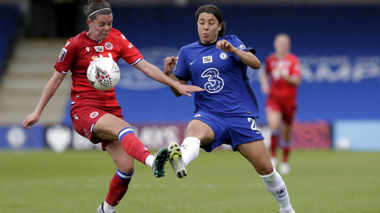 Reading’s Deanna Cooper and Chelsea’s Sam Kerr fight for possession of during their Barclays FA Women’s Super League clash at Kingsmeadow on Sunday.