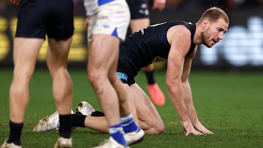 Carlton’s Harry McKay on all fours after copping a knock in the third quarter against North Melbourne.