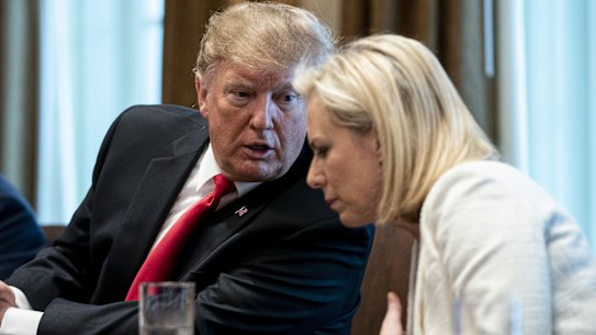 US President Donald Trump with former   secretary of homeland security. Kirstjen Nielsen.