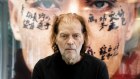 “I override my bad feelings by doing things,” says Brian Sherman, sitting in front of an artwork by Zhang Huan.