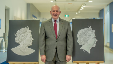 Governor-General Sir Peter Cosgrove with the old and new effigy of the Queen. The new portrait, left,  was unveiled in Canberra on Monday. 
