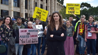 21-year-old anti-euthanasia campaigner Izzy Lindsey, rallying on the steps of Parliament House, says she worries the laws will open "dangerous doors".