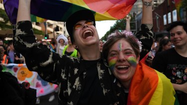 Revellers on Oxford Street celebrate the outcome of the same-sex marriage plebiscite.