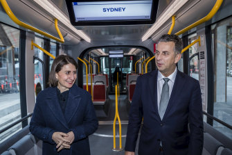 Premier Gladys Berejiklian and Transport Minister Andrew Constance inspect a tram parked at Town Hall.
