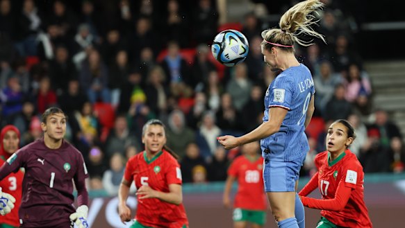 France’s Eugenie Le Sommer heads the ball to score her team’s fourth goal against Morocco.